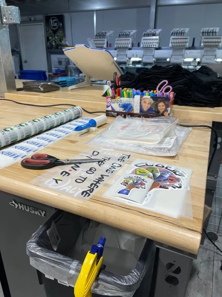 Workspace setup for custom apparel production – Game Over Merch