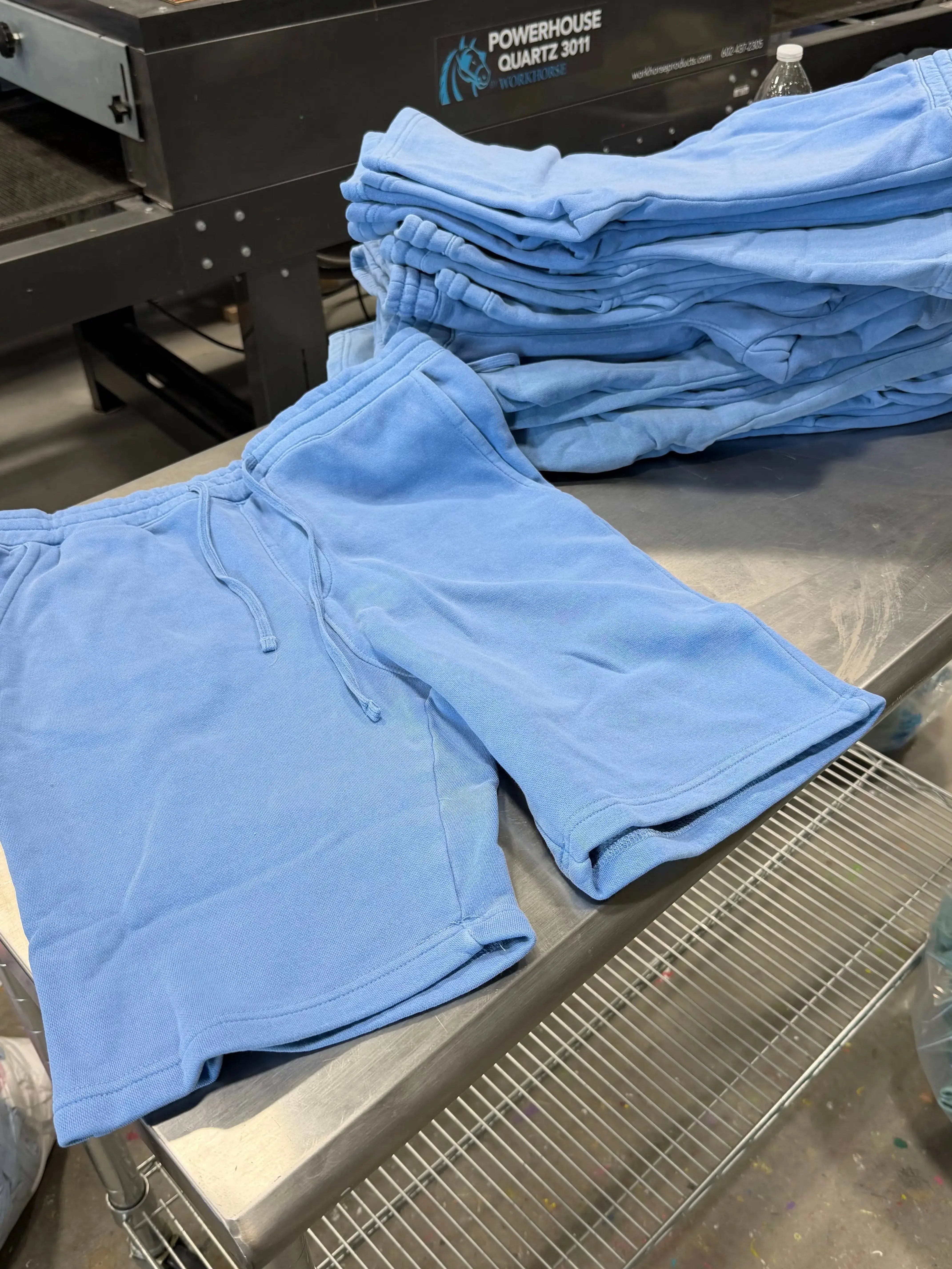 Blue pants on a metal surface with a blurred background